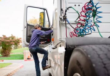 Student getting into truck